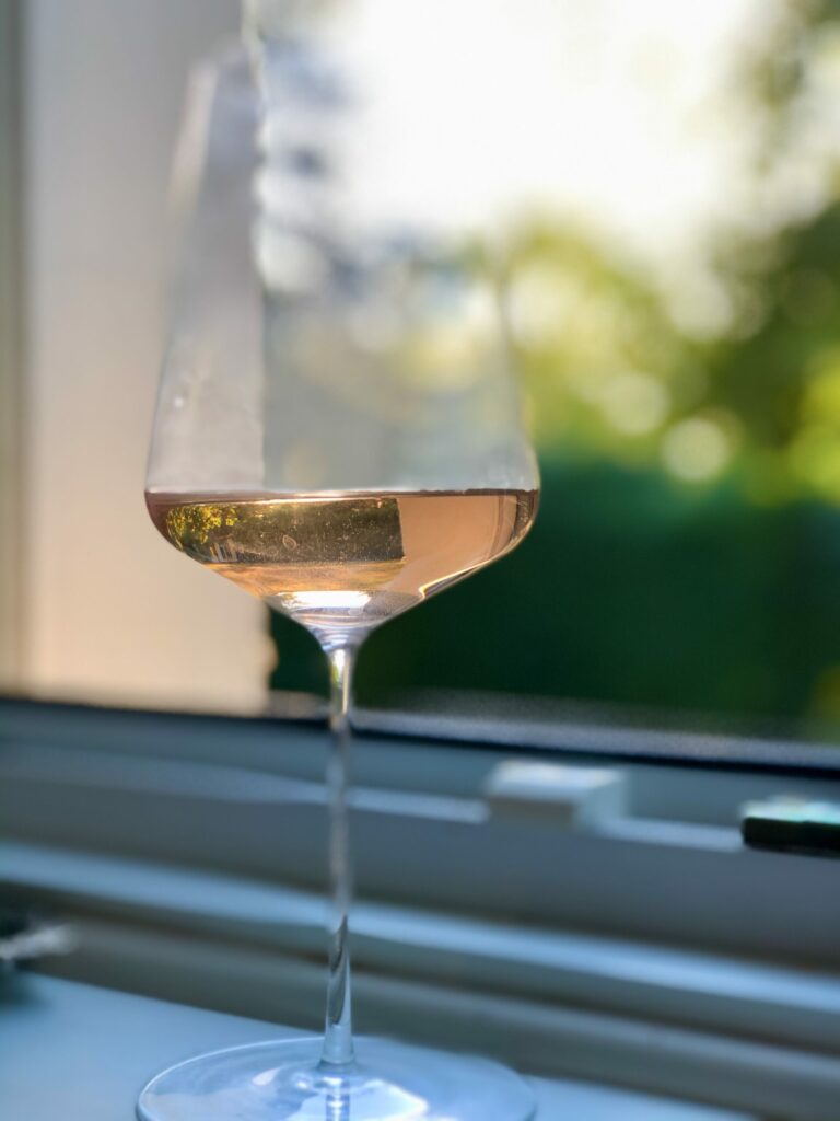 Glass of Blanc de Noir wine on a windowsill