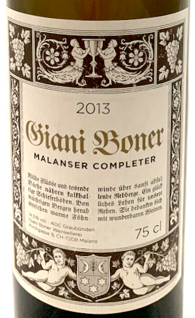 Close-up of an ornate, cream-colored Giani Boner 2013 Malanser Completer wine label