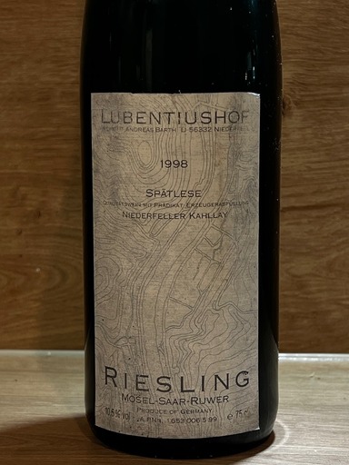 Tall, rectangular wine label, faded white/grey with black lettering RIESLING