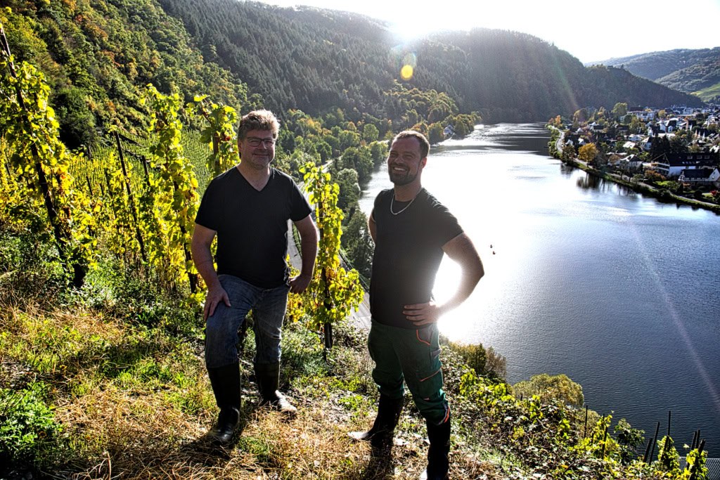 German winemaker Gernot Kollmann stands on the banks of his steep Pinot vineyards .