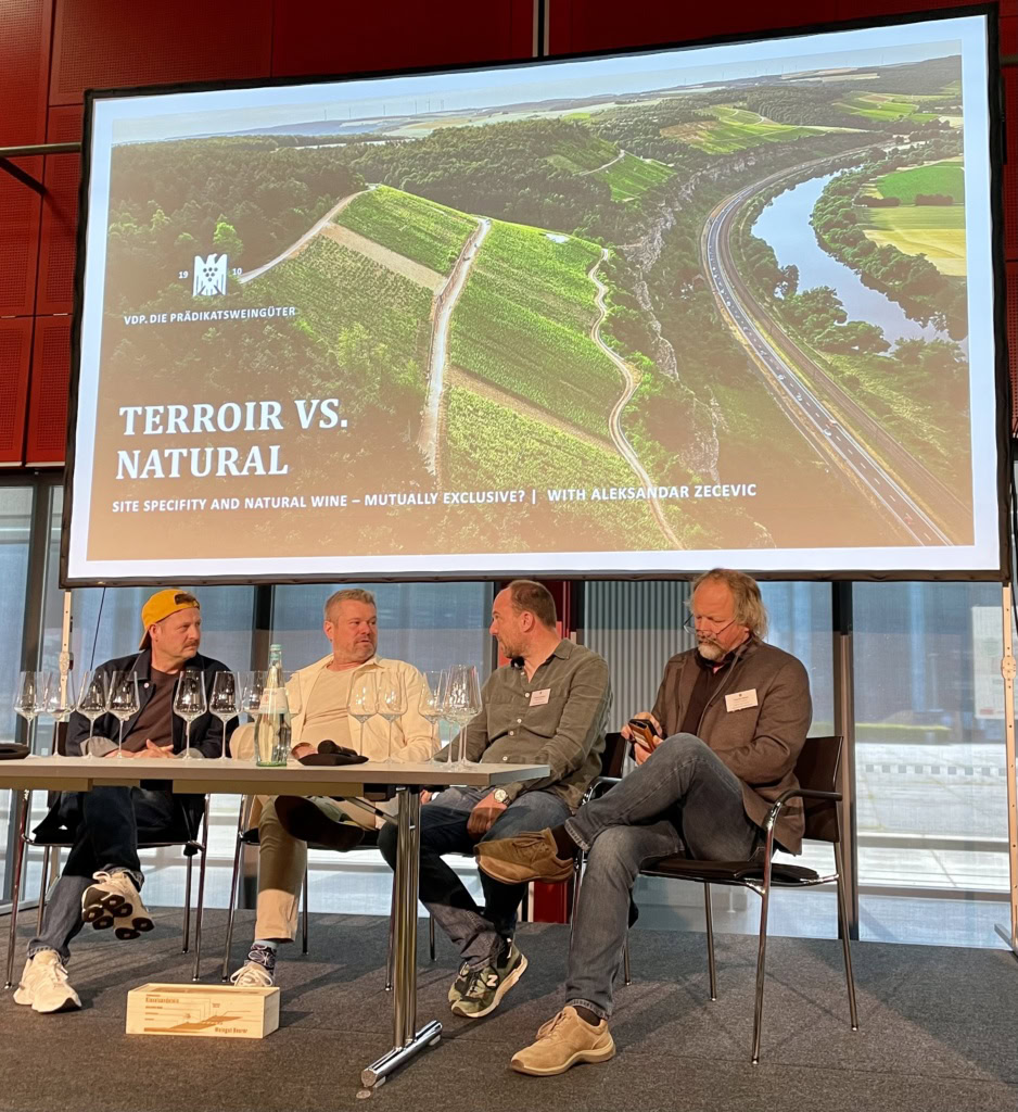 A panel of organic, biodynamic, and natural winemakers on stage to discuss "Terroir vs. Natural" at the VDP Weinbörse