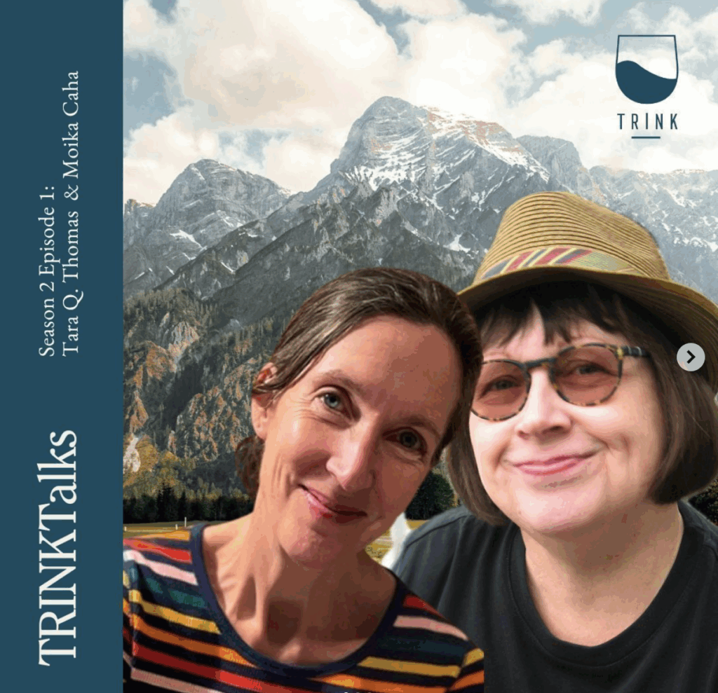 Monika Caha and Tara Q Thomas pose in front of Austrian mountains